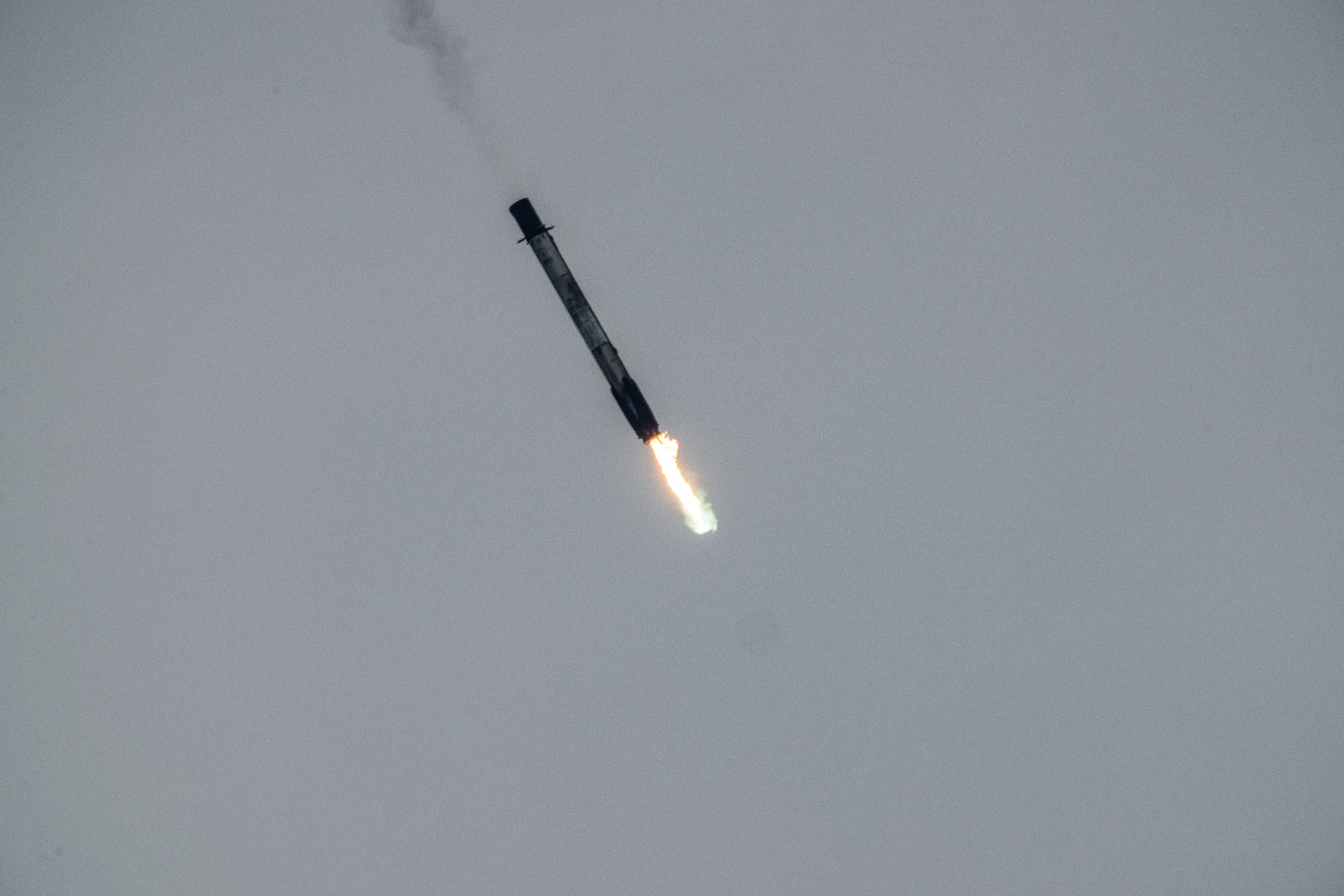 Falcon 9 booster performing a landing burn. Photo Credit: Eric Pearce, Florida Spaceflight