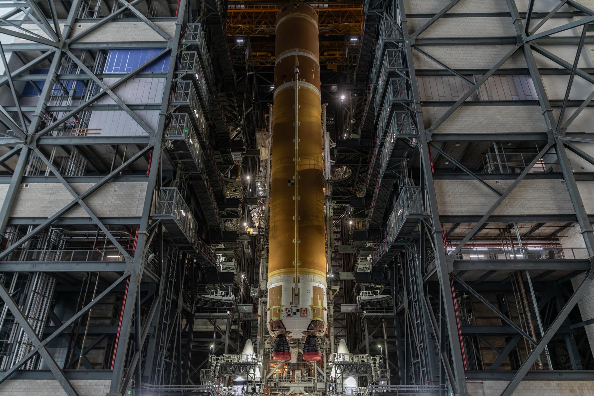 The SLS (Space Launch System) core stage is integrated alongside the twin solid rocket booster motor segments on Sunday, Oct. 25, 2026, inside the Vehicle Assembly Building at NASA's Kennedy Space Center in Florida completing its short stack configuration.