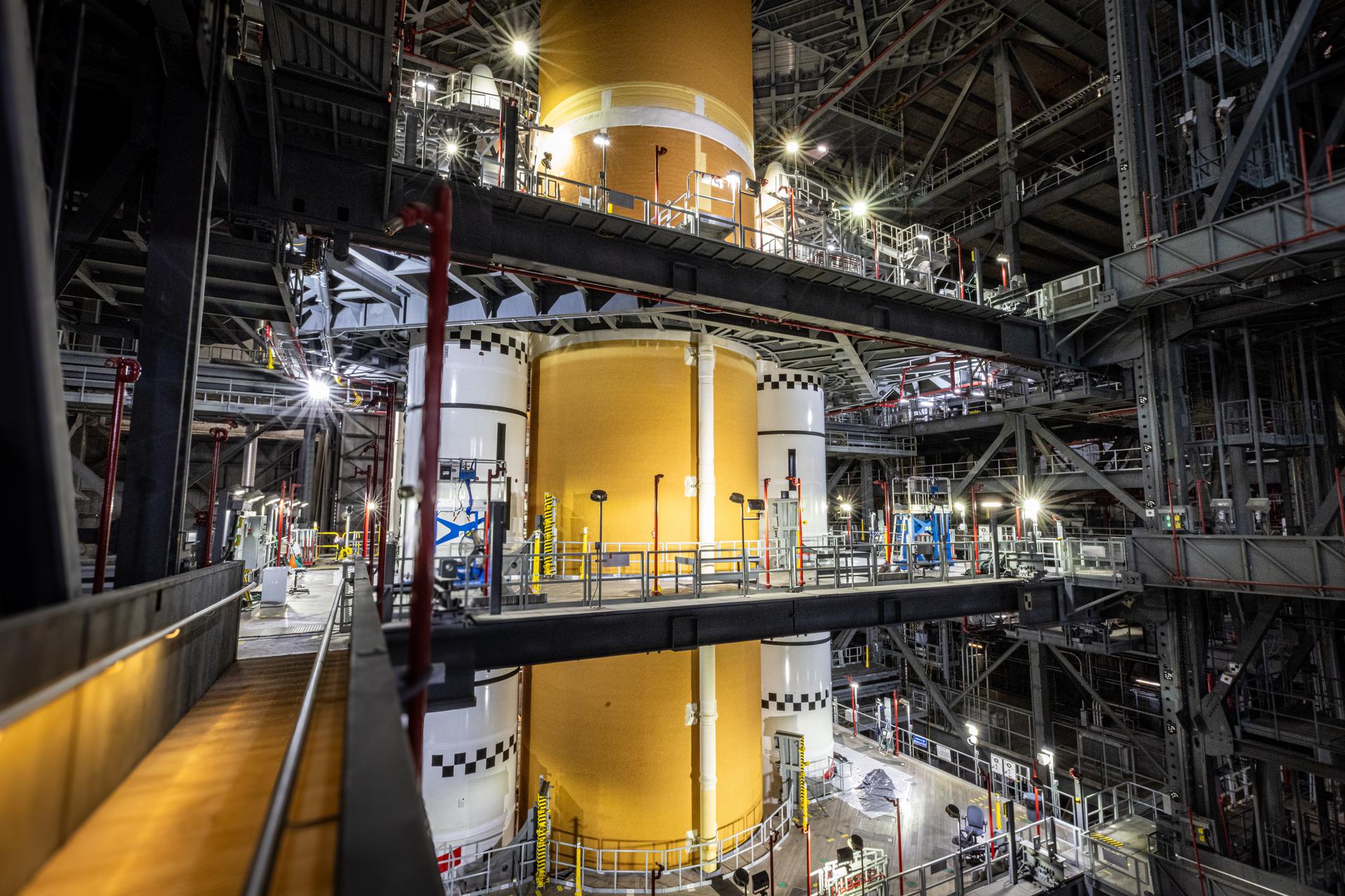 The SLS (Space Launch System) core stage is integrated alongside the twin solid rocket booster motor segments on Sunday, Oct. 25, 2026, inside the Vehicle Assembly Building at NASA's Kennedy Space Center in Florida completing its short stack configuration. Photo Credit: NASA